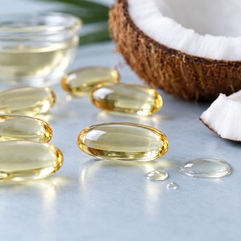 Close-up of R-ALA softgels in coconut oil